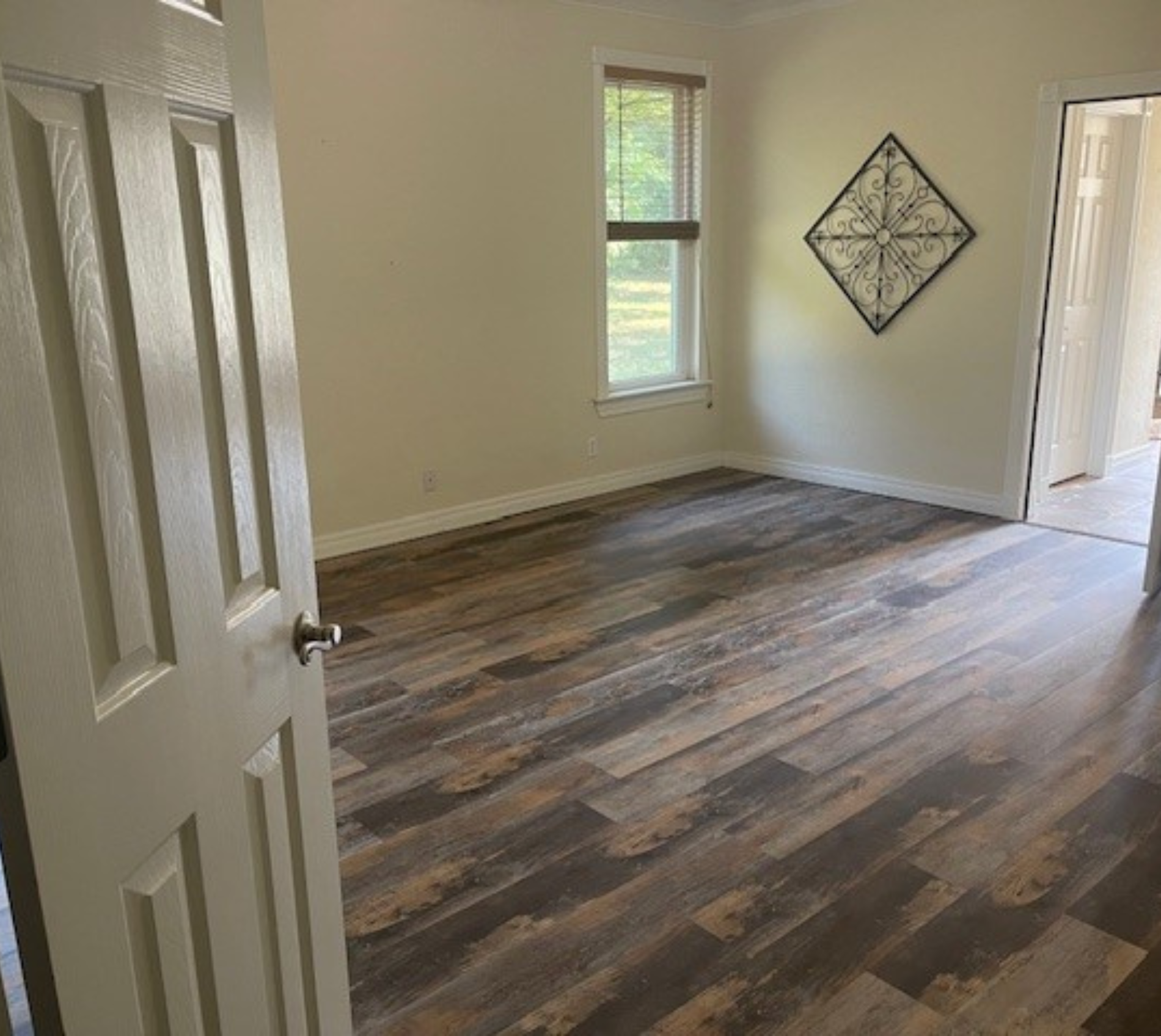 Recently completed home installation of a laminate hardwood looking floor.