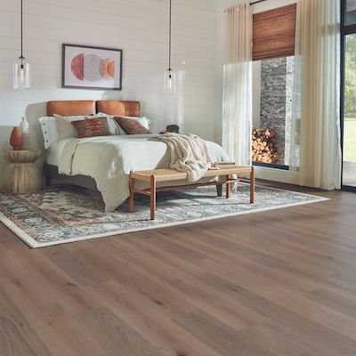 laminate floors in a bright rustic bedroom