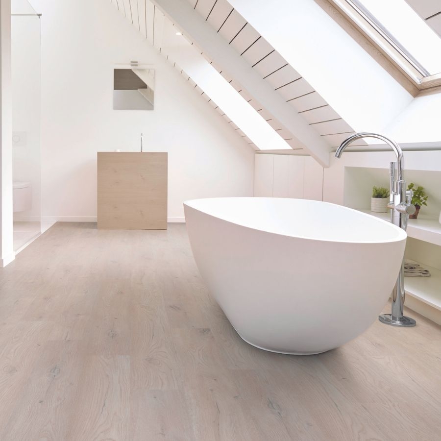 wood look luxury vinyl flooring in bathroom with soaker tub